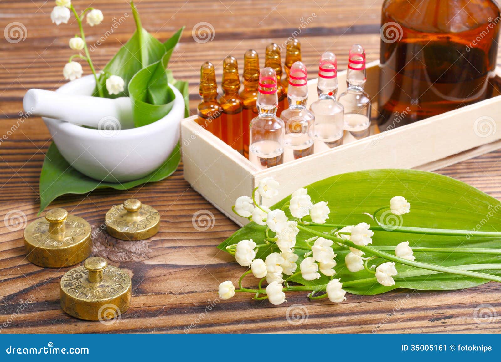 Lilies Of The Valley And Essential Oil In Vial Stock Photo