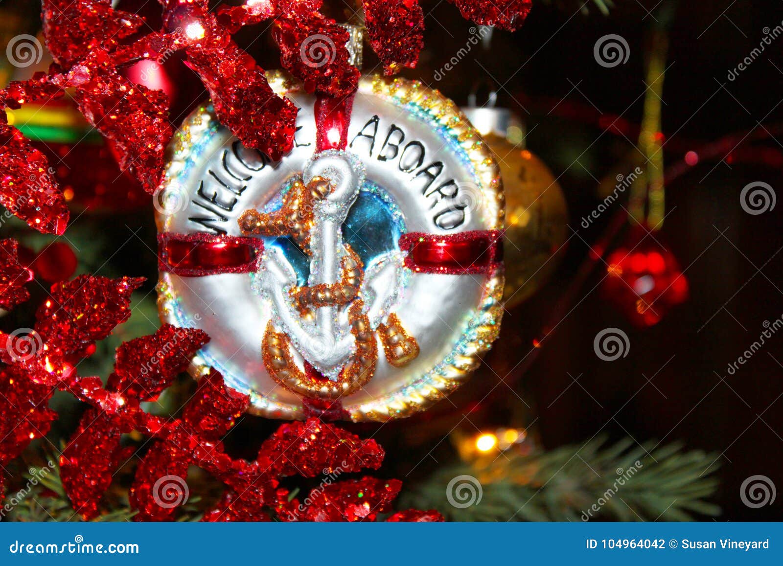 nautical christmas ornament with anchor that says welcome aboard on chistmas tree