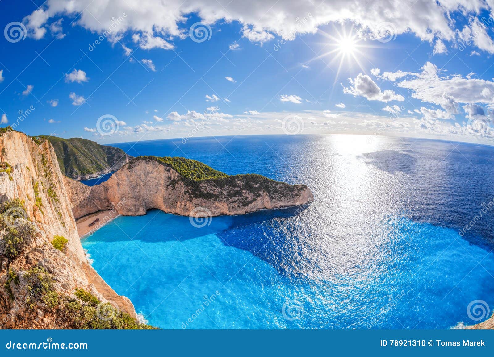 navagio beach with shipwreck against sunset on zakynthos island in greece