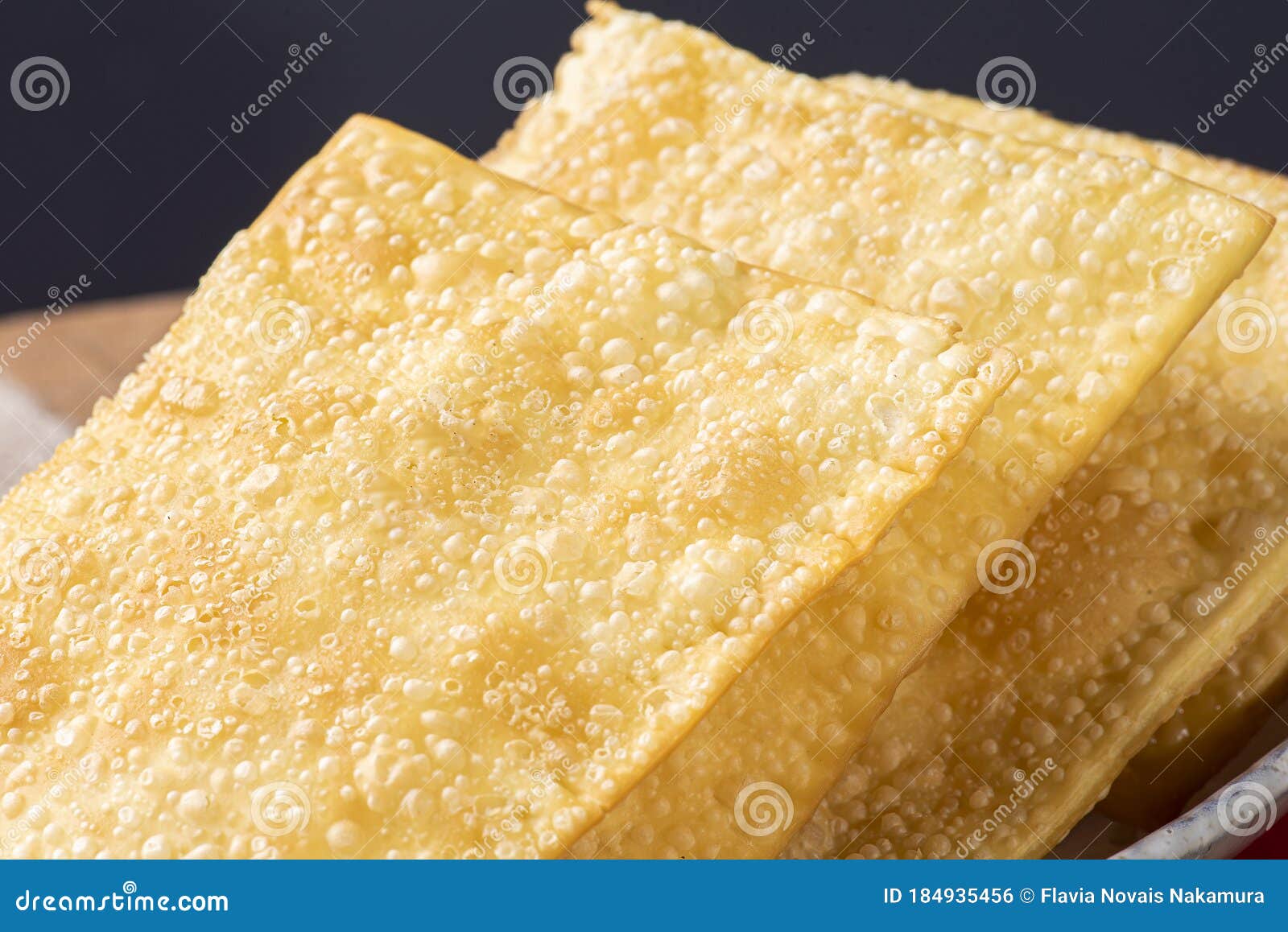 brazilian snack called pastel. stuffed with cheese. close-up photo