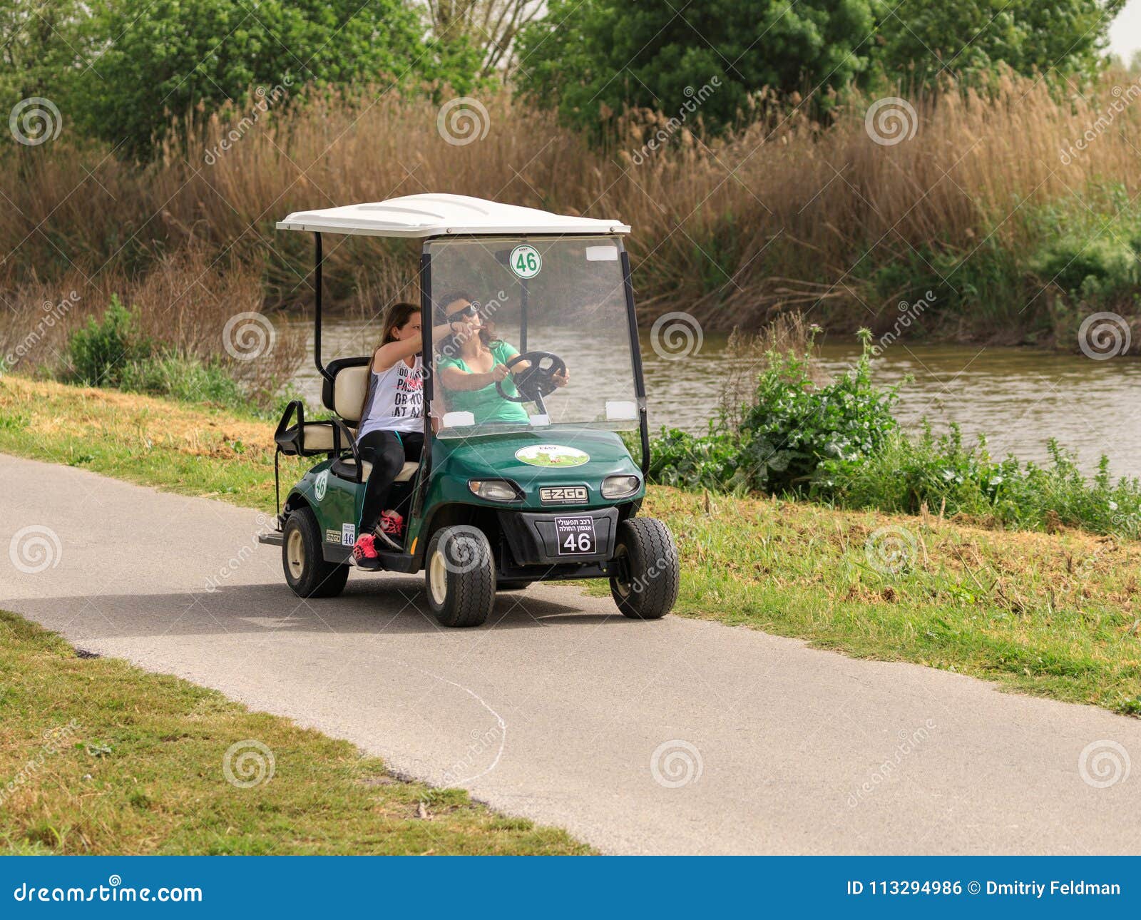 Visitors Drive Along An Electric Vehicle Path In The Hula Lake