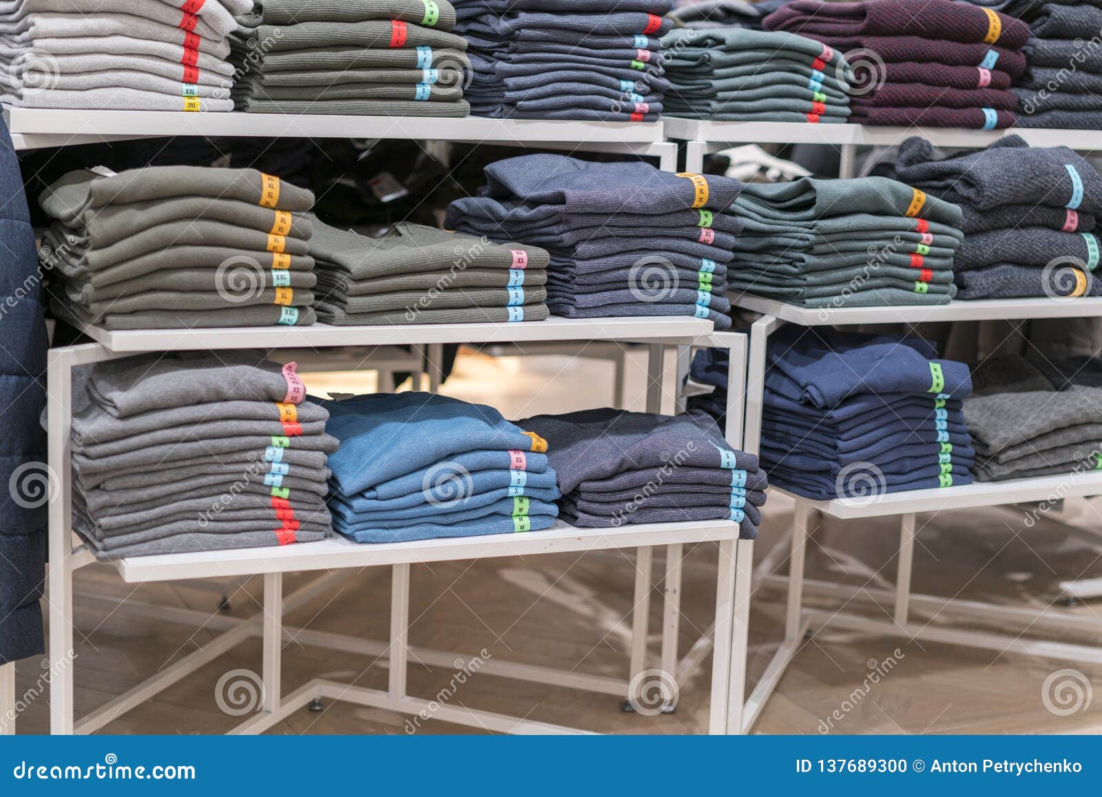 Neat Stacks of Folded Clothing on the Shop Shelves. Color Folding Shirt ...
