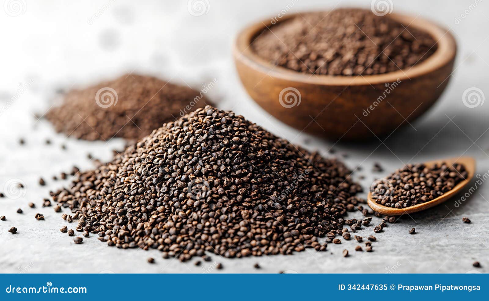 neatly mounded cumin seeds on a surface