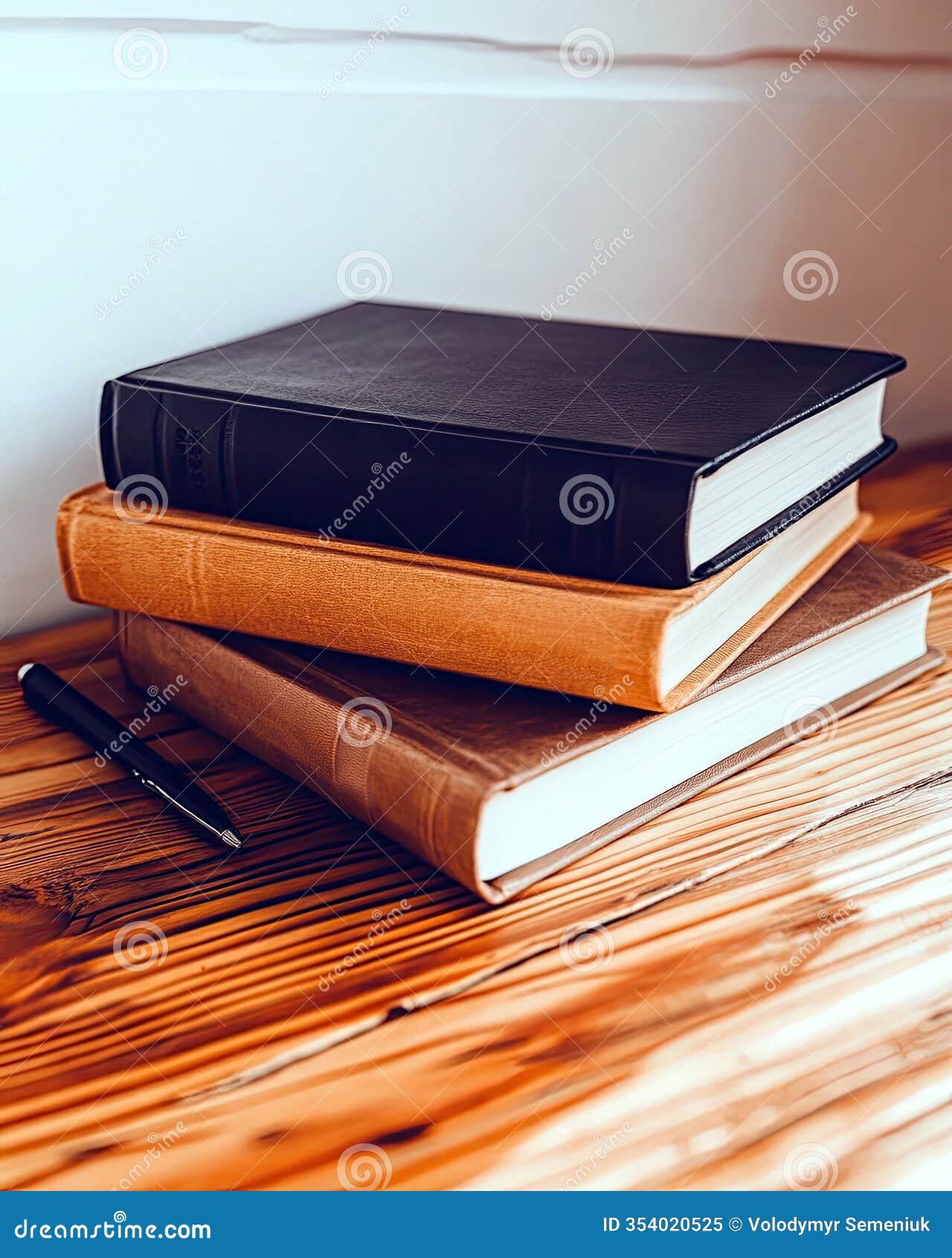 neatly stacked books on a wooden table inviting quiet reflection and contemplation
