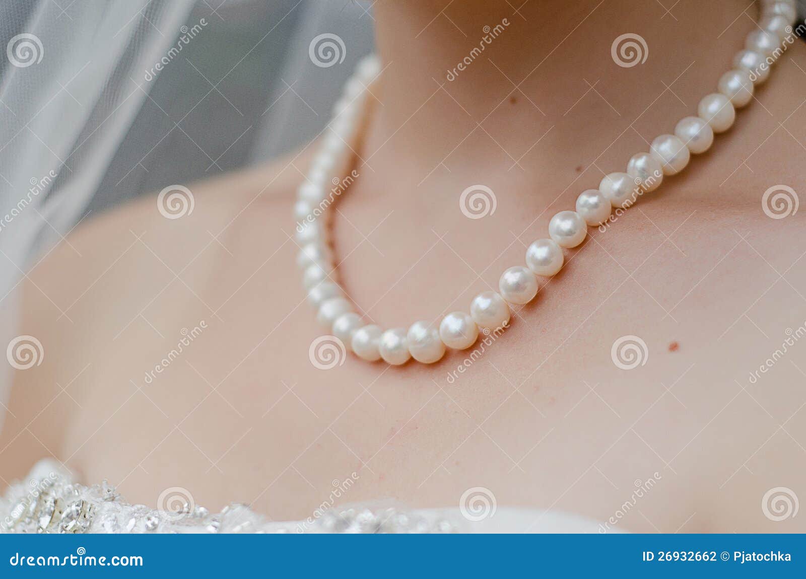 neck of bride with string of pearls