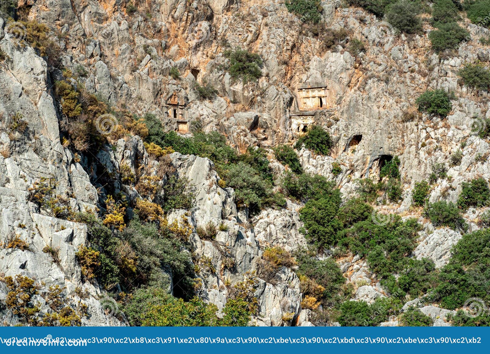 rocky necropolis with stone-cut tombs in myra lycian demre, turkey