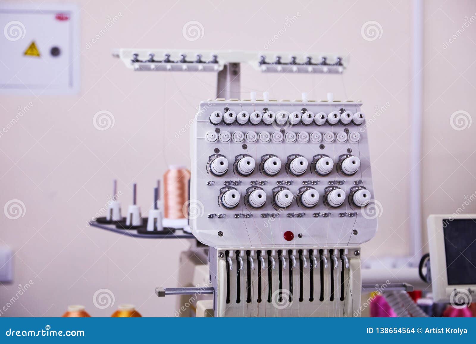 12 Needle Compact Embroidery Machine. Industrial Embroidery Stock Photo
