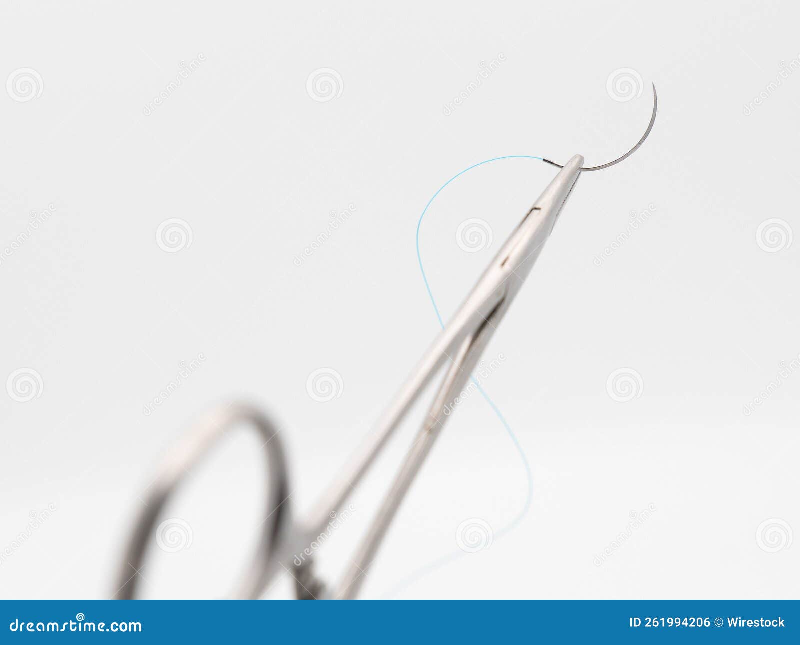 Needle holder and needle stock photo. Image of suturing 261994206