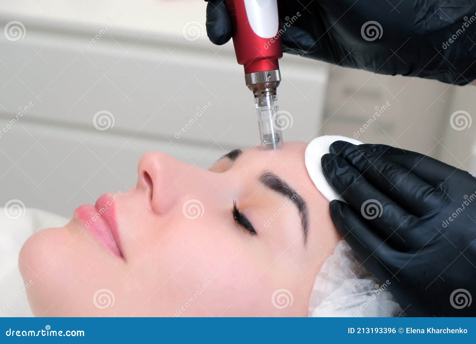 needle mesotherapy. cosmetologist performs needle mesotherapy on a womans face