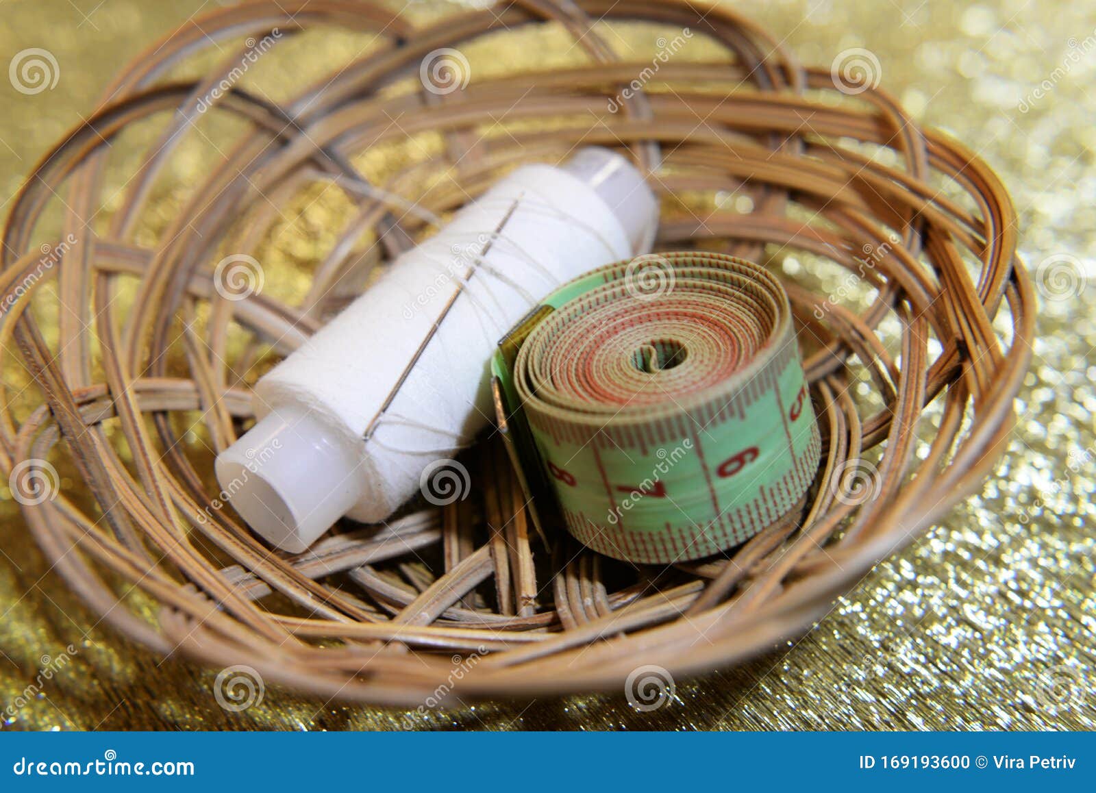 Needle with a Skein of White Thread and a Centimeter Stock Photo