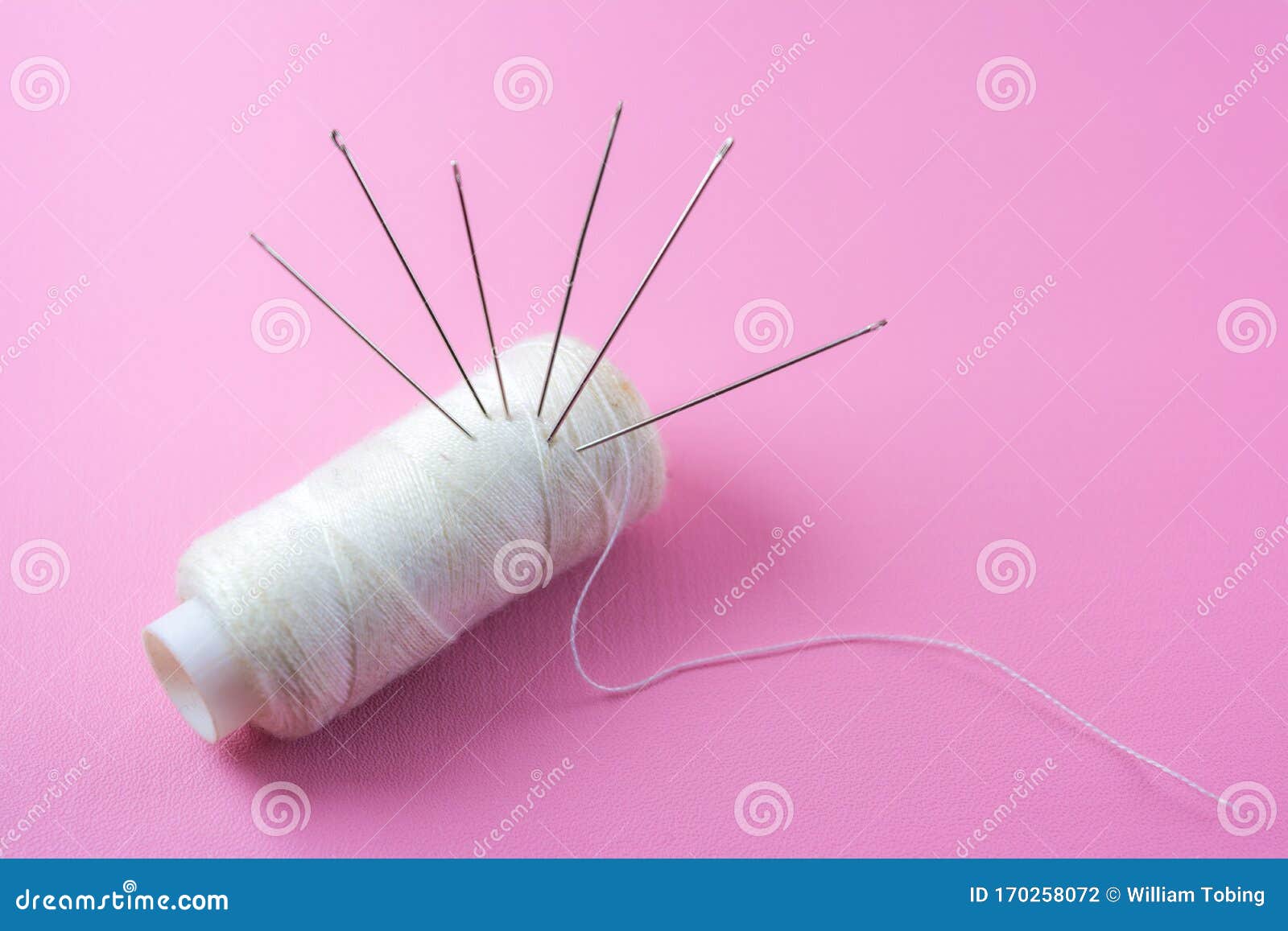 Needle and Thread Isolated on Pink Background, Symbol of Garment ...