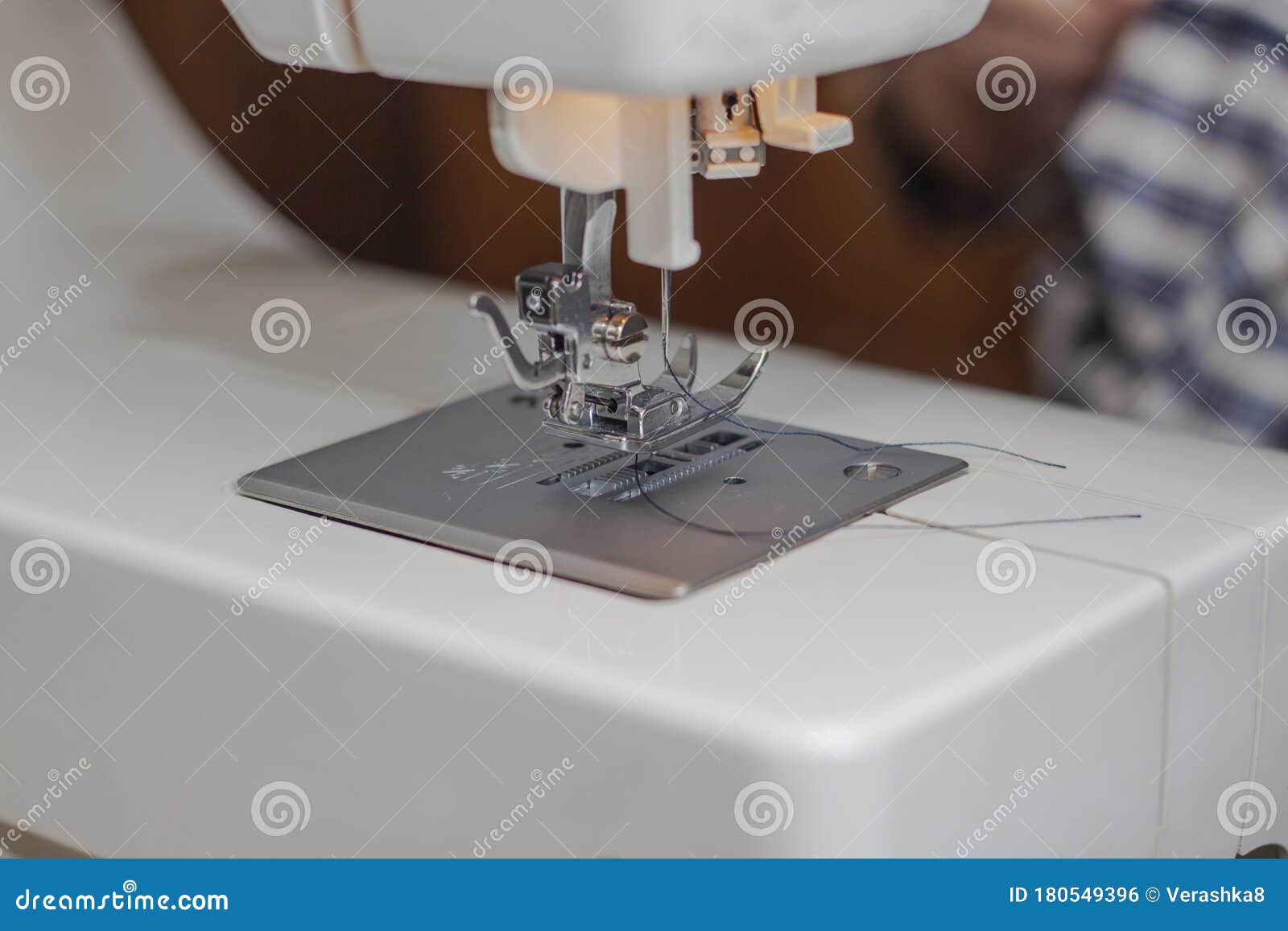 Needle and Thread in the Sewing Machine. the Process of Sewing at Home