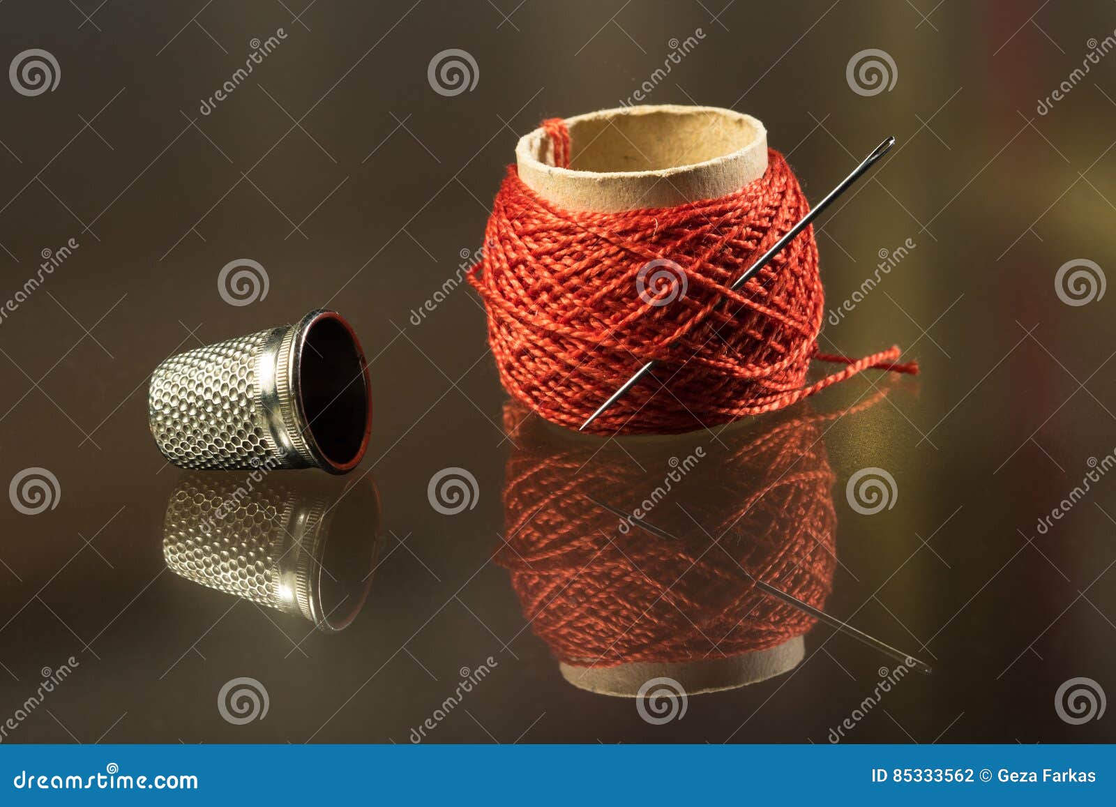 Needle, thread and thimble stock photo. Image of chore 85333562