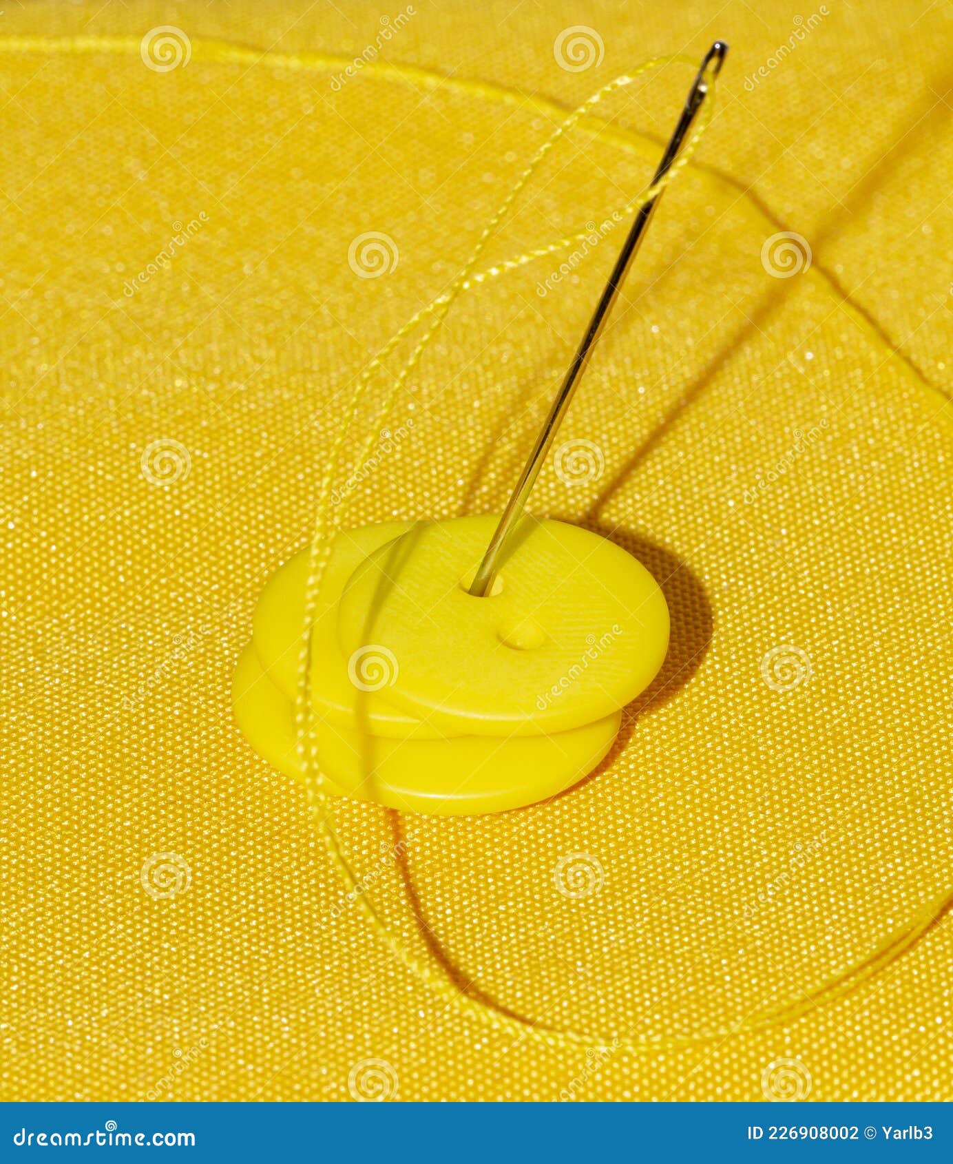 Needle and Thread and Yellow Buttons on Yellow Stock Photo Image of