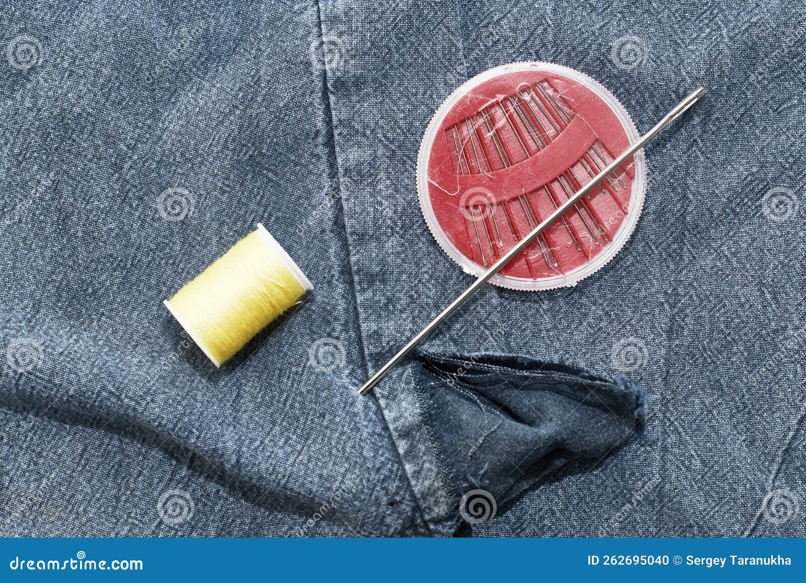 needles thread background torn jeans concept reasonable consumption needlework small businesses high quality 262695040