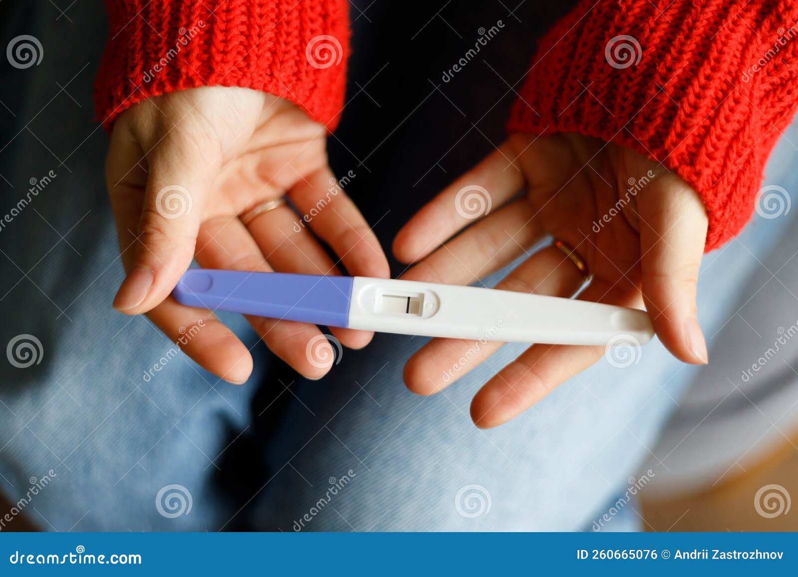 Negative Pregnancy Test with One Strip in Female Hands, Closeup Stock