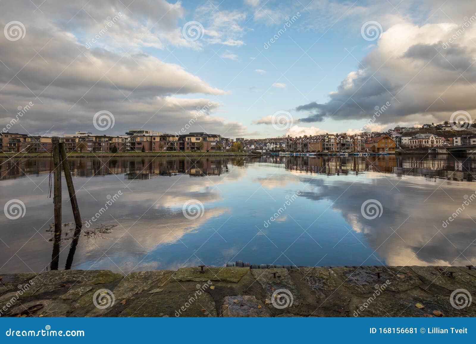 neighbourhood secret garden in kjoita seen from other side of the river otra, in kristiansand, norway