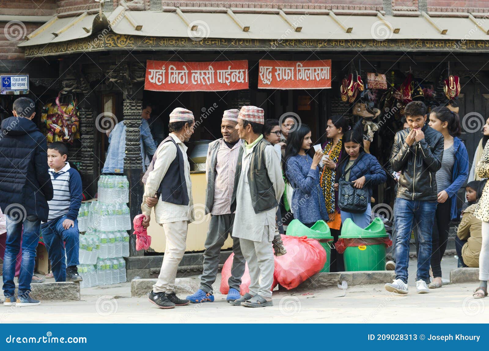 Nepali Men In Traditional Clothing And Dhaka Topi Hats Chatting Together Kathmandu Nepal