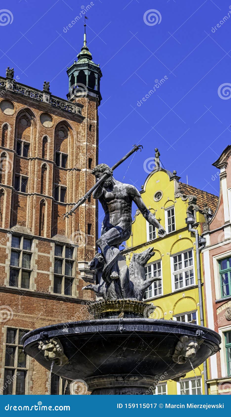 neptune`s fountain in front of vintage architecture of old town - long market, gdansk, tricity, poland