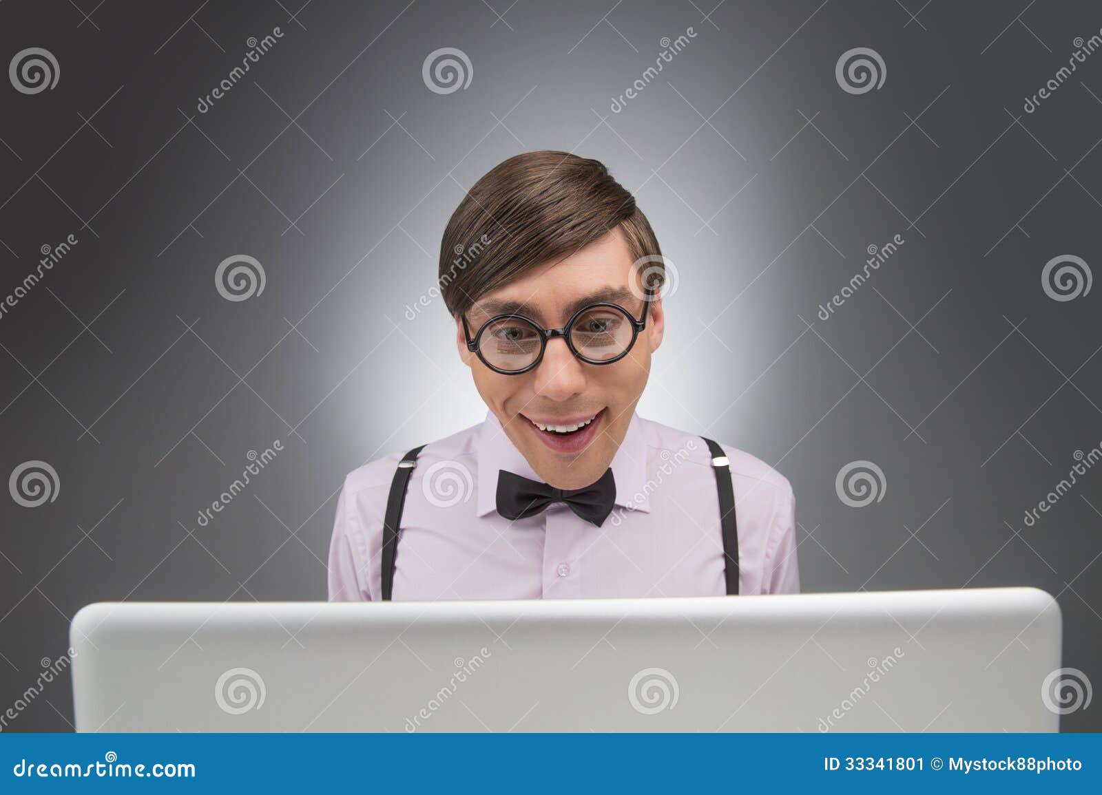 Nerd at the Computer. Young Nerd Man Working at the Computer while