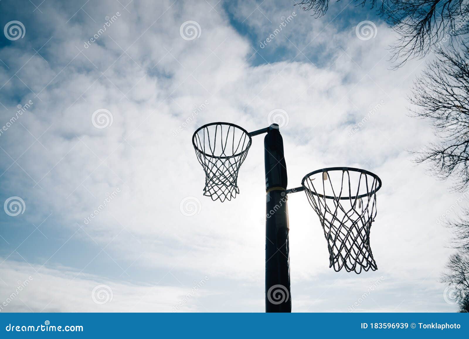 netball goal ring net against blue sky clouds hagley park christchurch new zealand 183596939