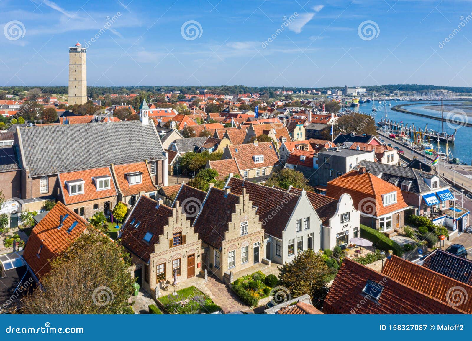 brandaris lighthouse and westerkerk, harbour and historical houses of west-terschelling town. west frisian islands.