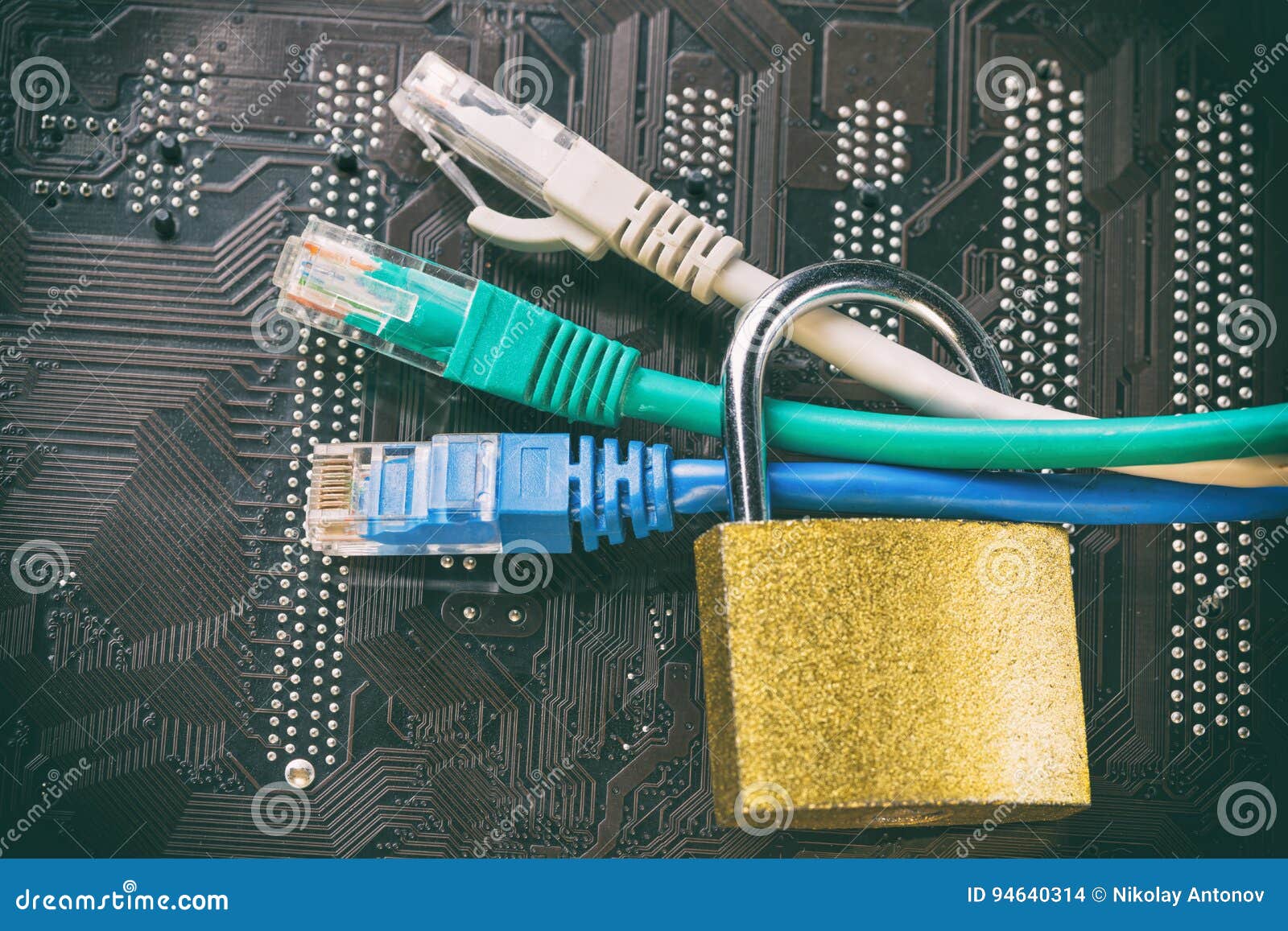 Network Cables in Padlock on Computer Motherboard. Data Privacy Information
