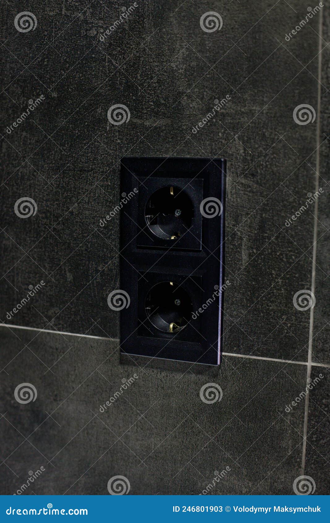 New Black Rosette on a Ceramic Tile of Black Color. Electrical Outlet. Bathroom. Stock Image