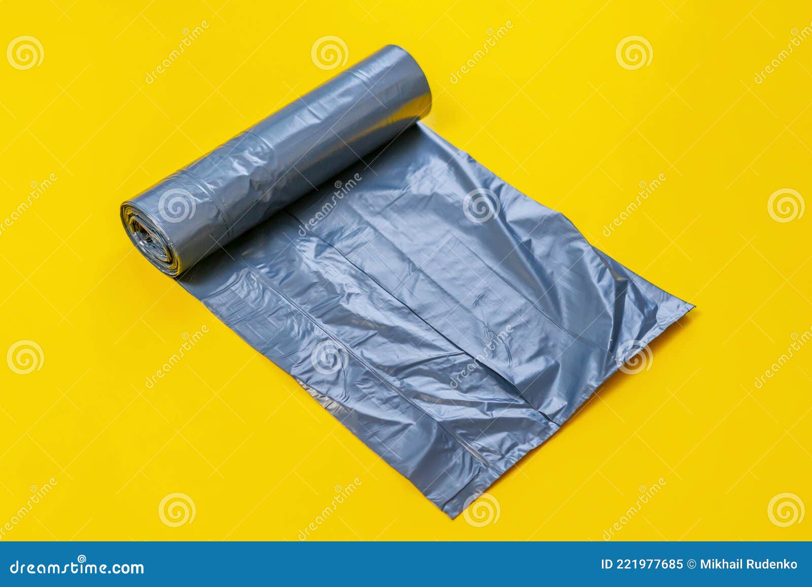 New Black Trash Bag Roll on the Colorful Surface, Isolated, Care the