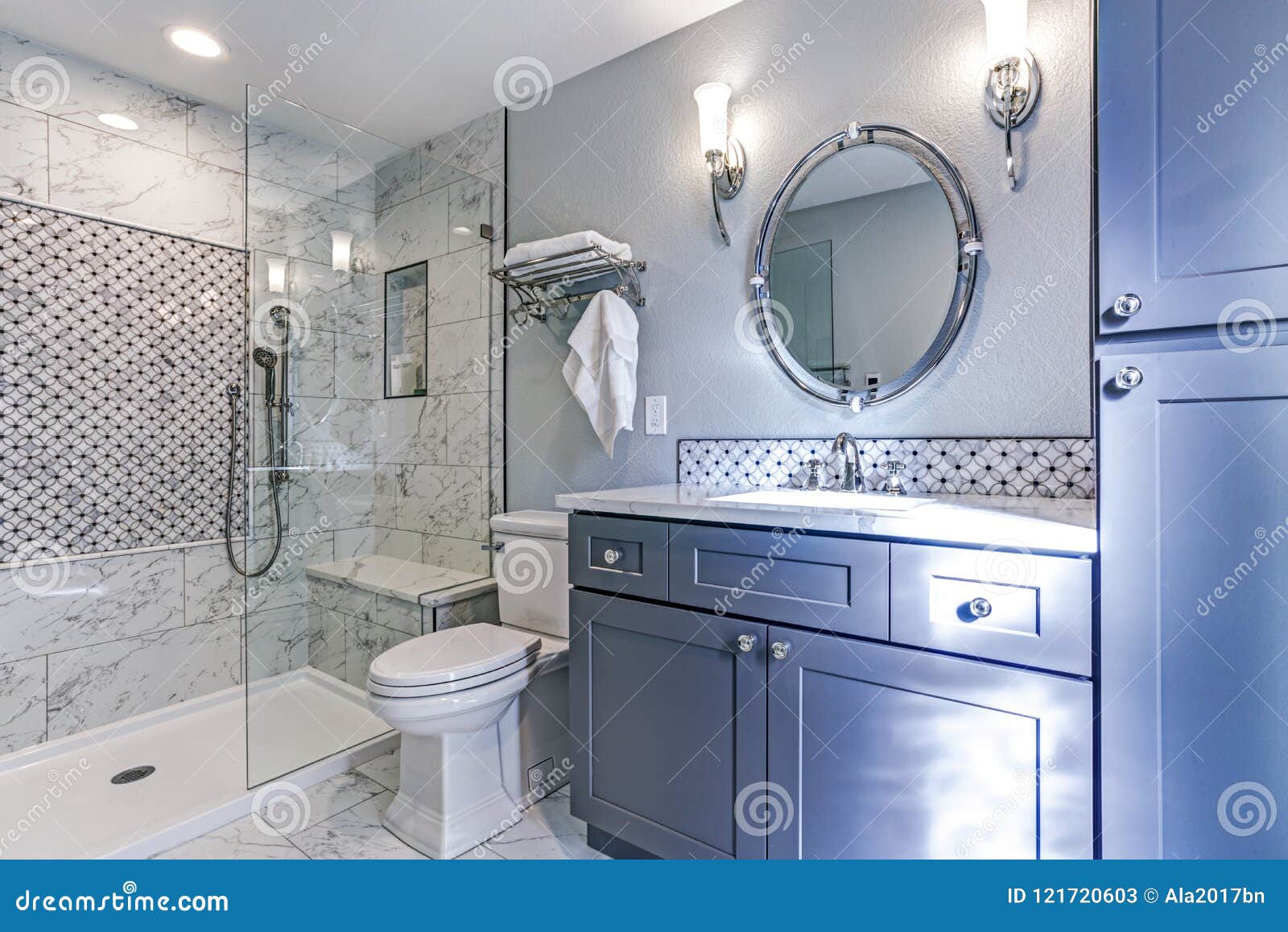 new blue bathroom  with marble shower surround