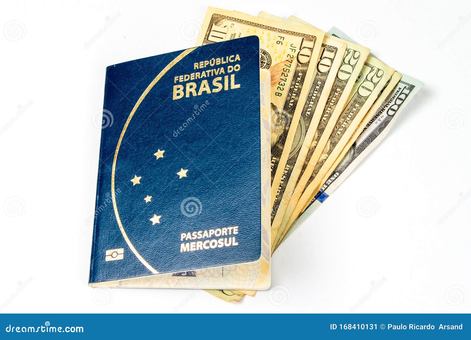 new brazilian passaport, with some dollar bills in a white background.