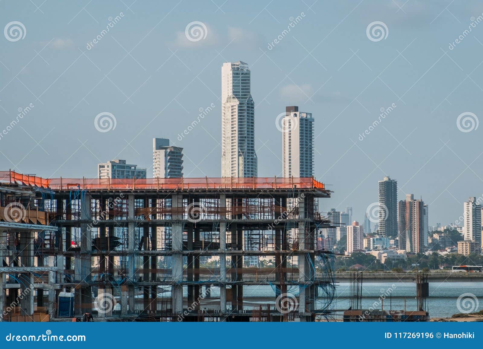 new building under construction with skyscraper skyline background -