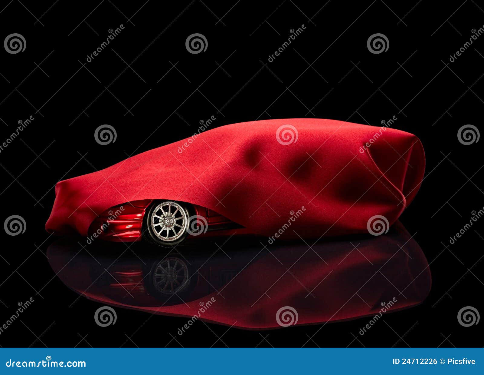 new car hidden under red cover
