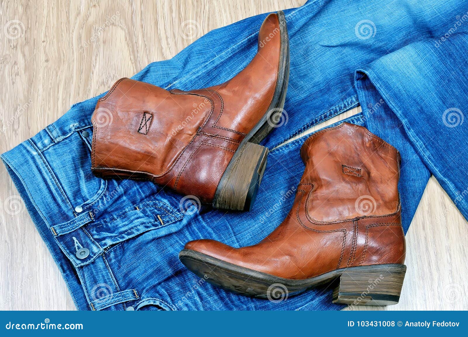 Brown Cowboy Boots on Blue Jeans Stock Photo - Image of heelpiece ...