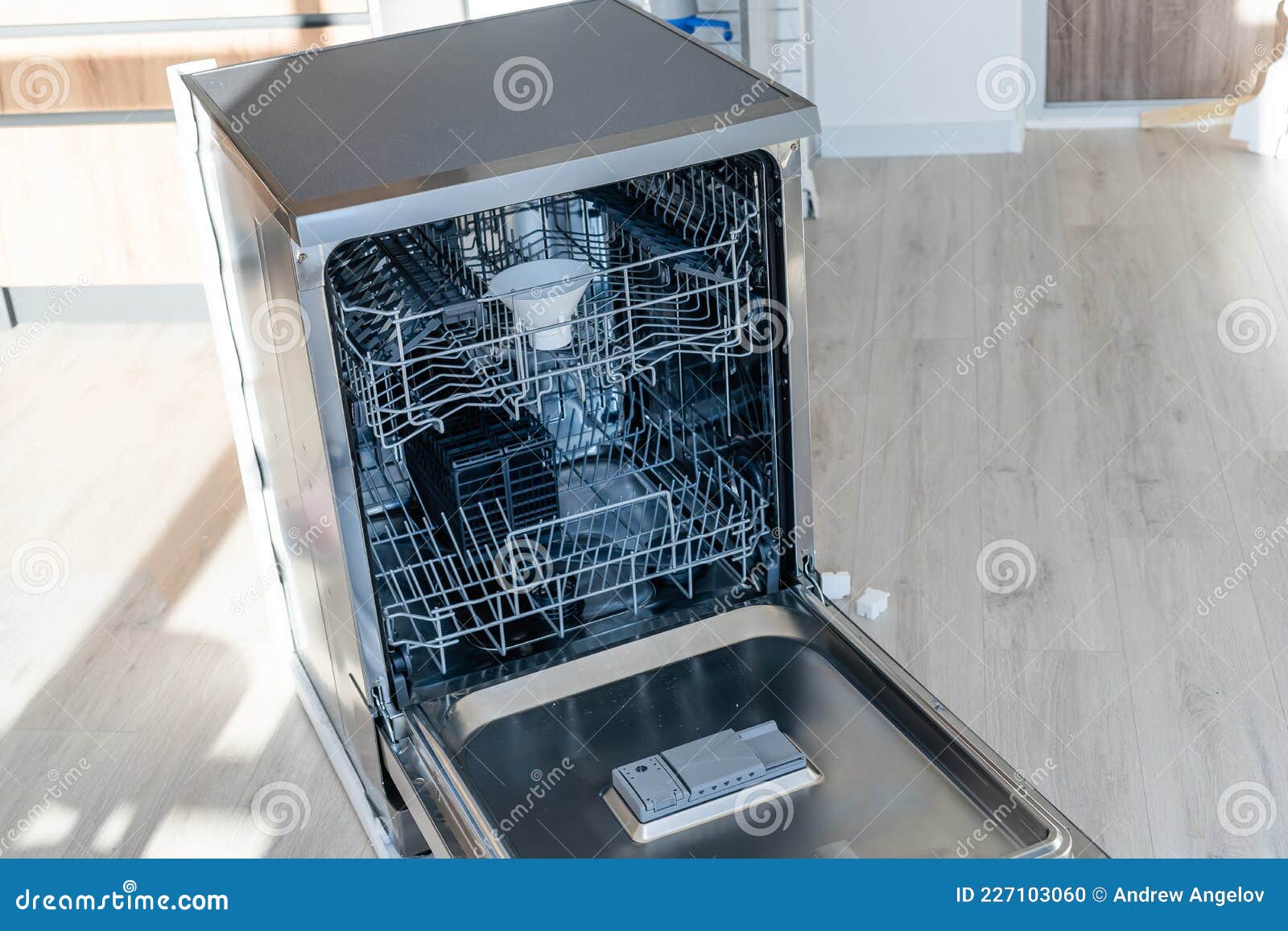 New Dishwasher in Modern Kitchen. Stock Photo Image of technology