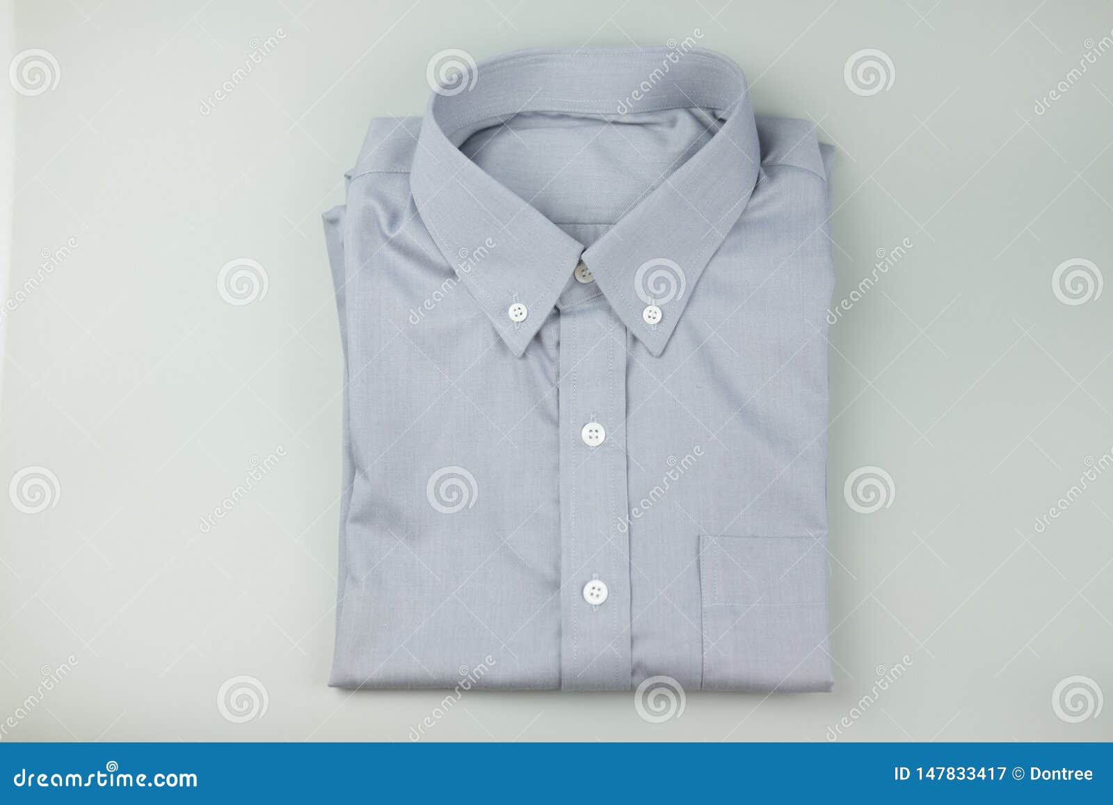 A new gray men`s shirt stock image. Image of business - 147833417