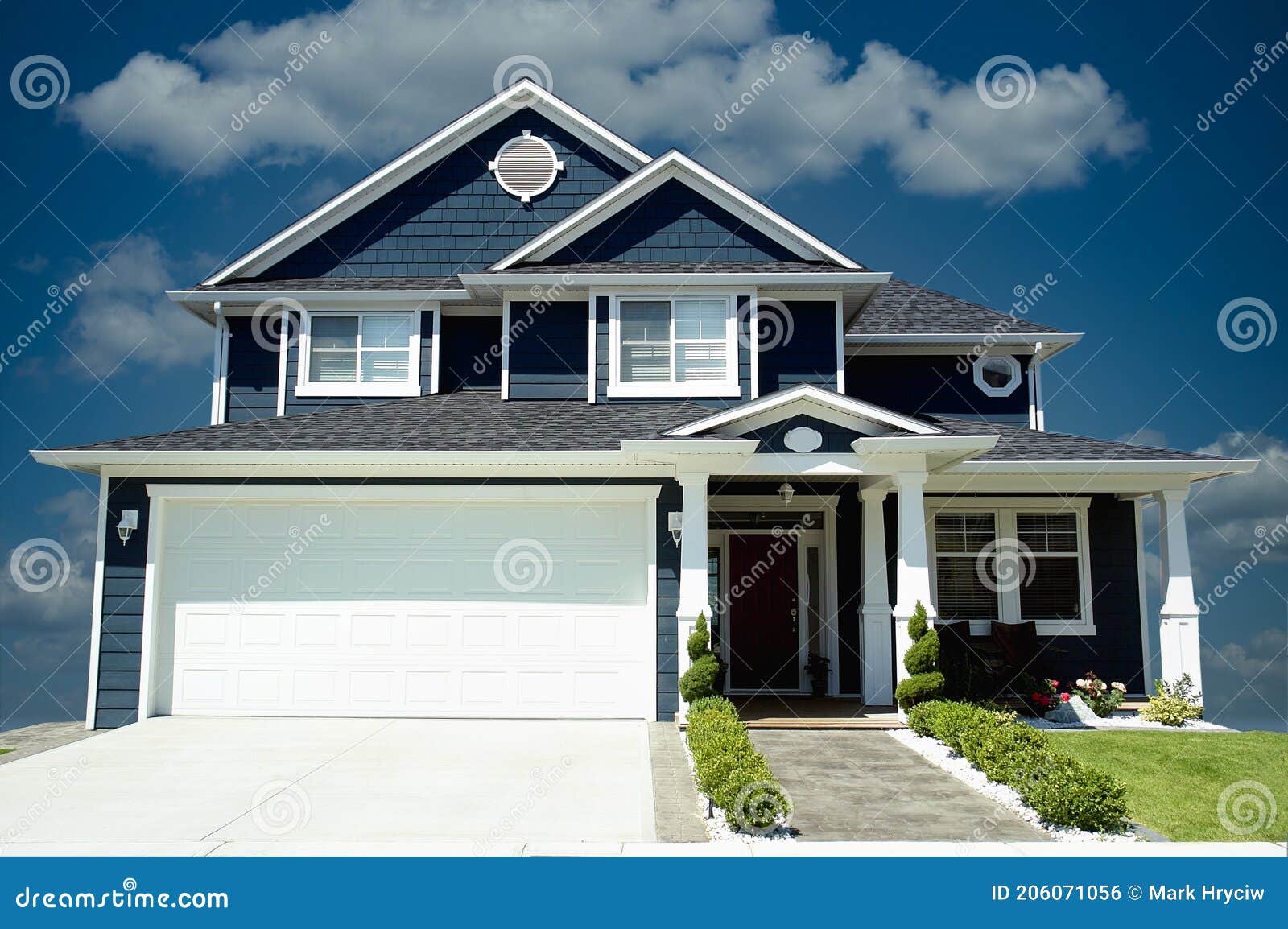 new home house blue exterior dramatic blue sky background