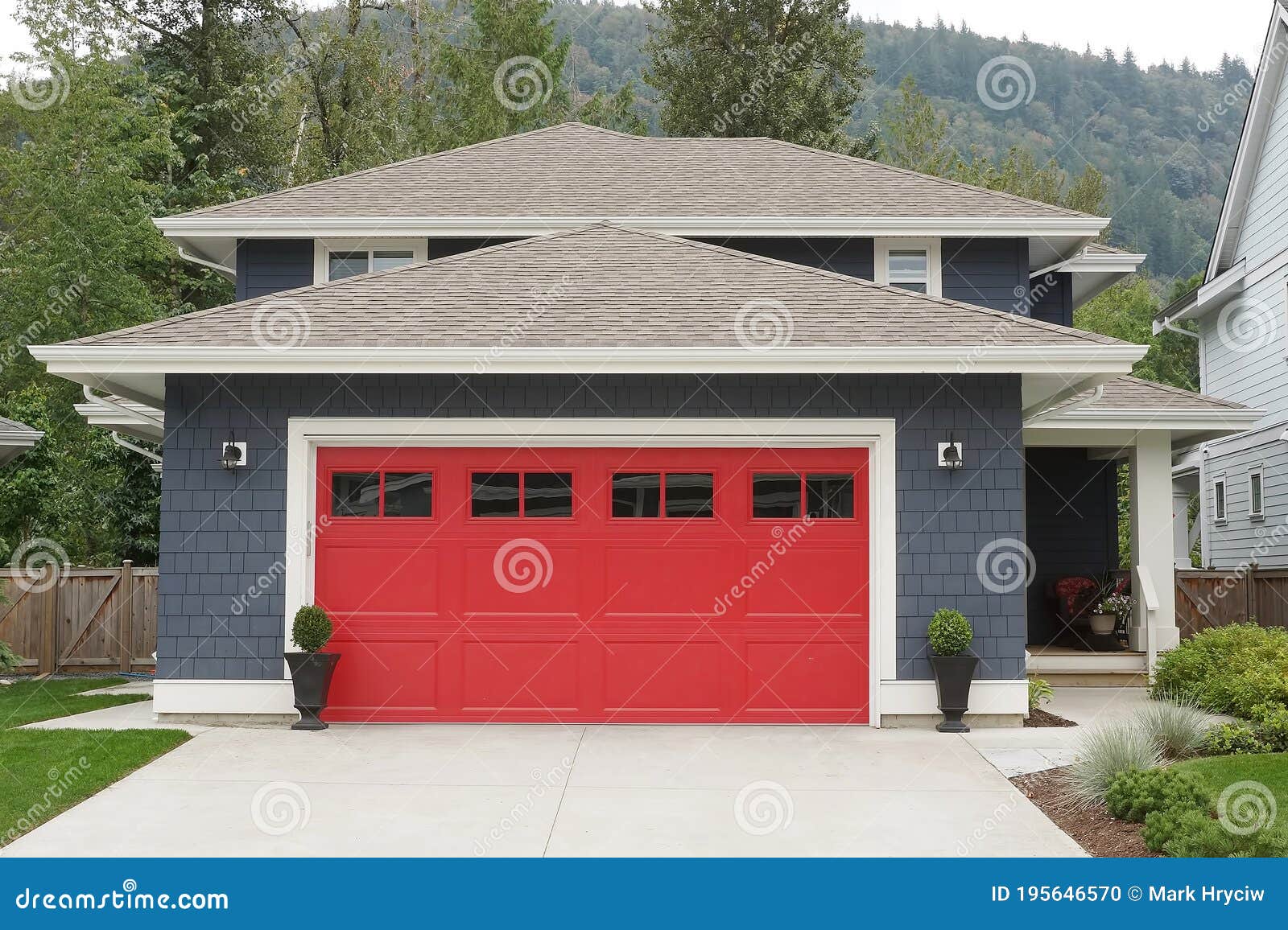 new home house exterior blue with a bright red garage door elevation