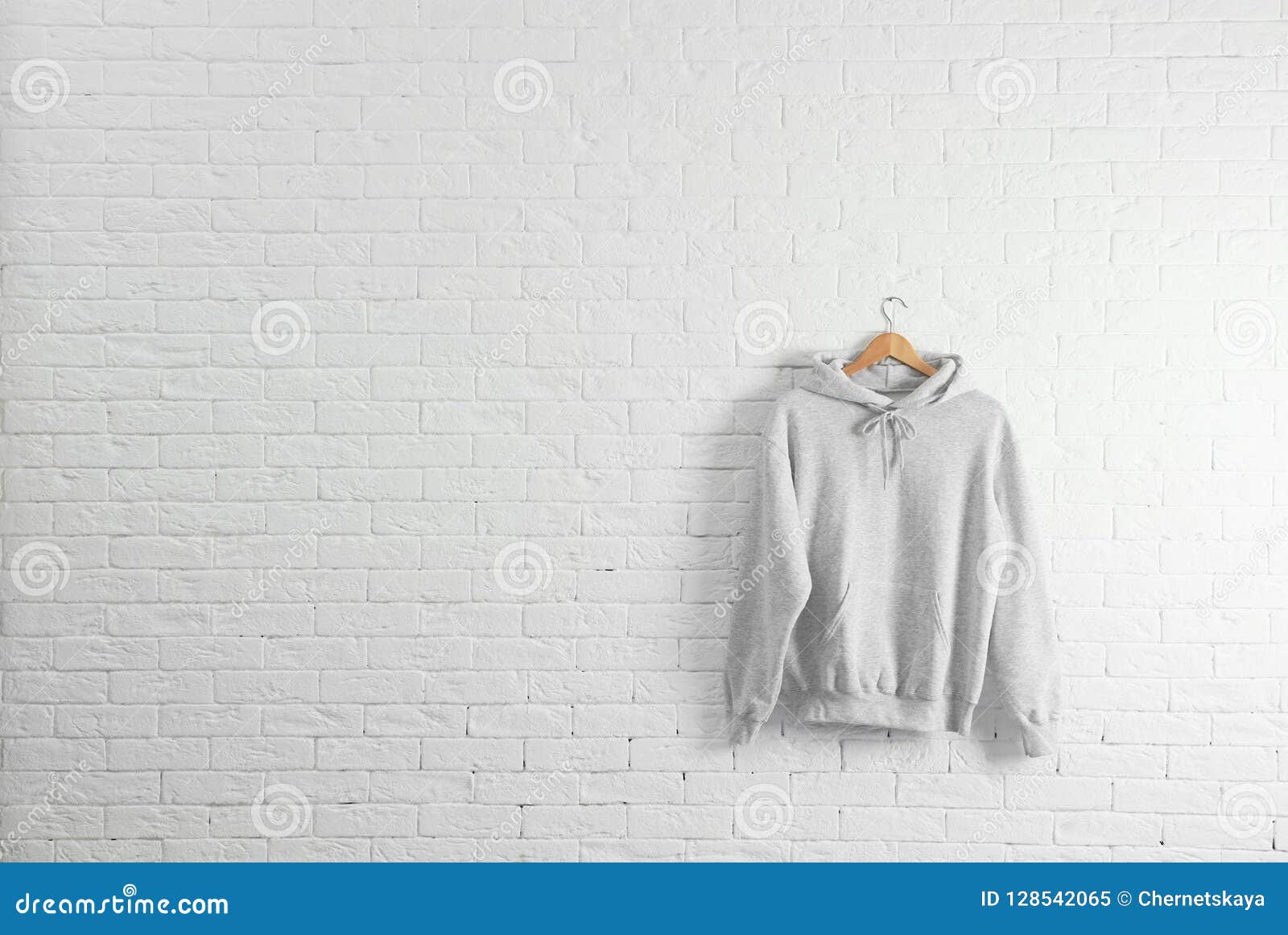 Download New Hoodie Sweater With Hanger On Brick Wall Stock Image ...
