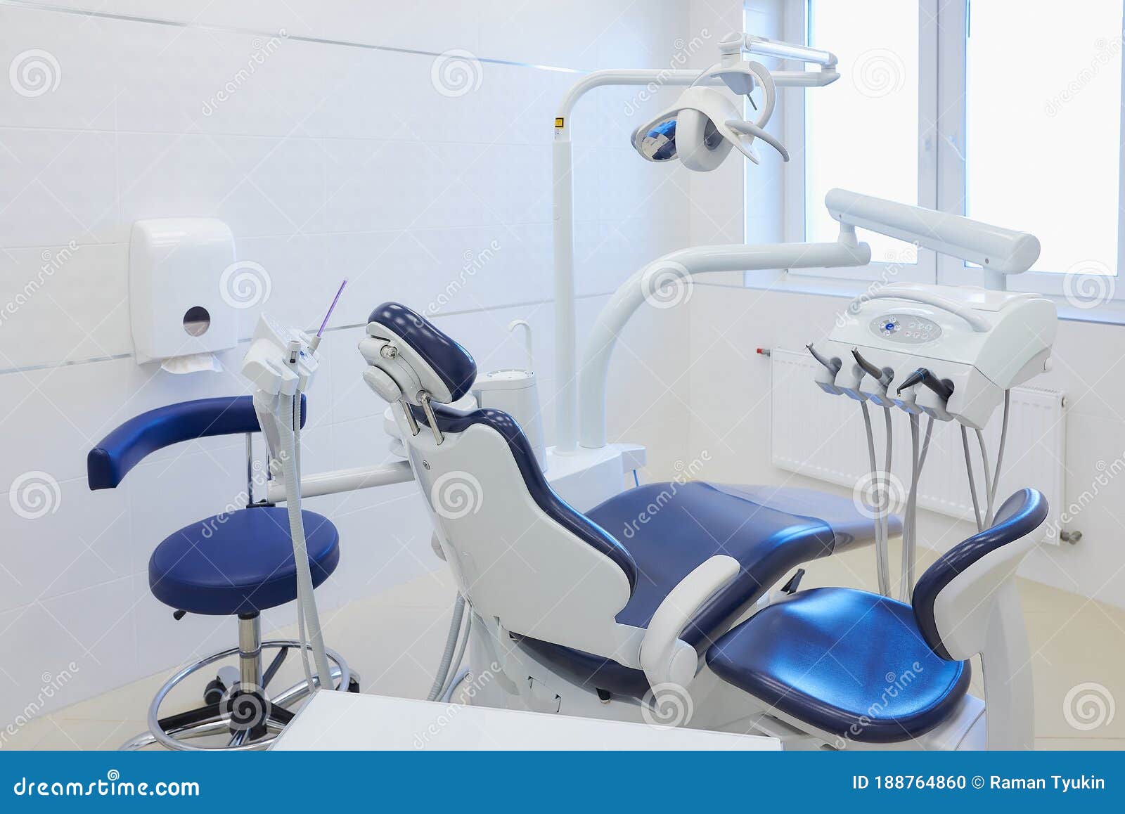 an interior of a dental office with white and blue furniture. dentistÃ¢â¬â¢s office