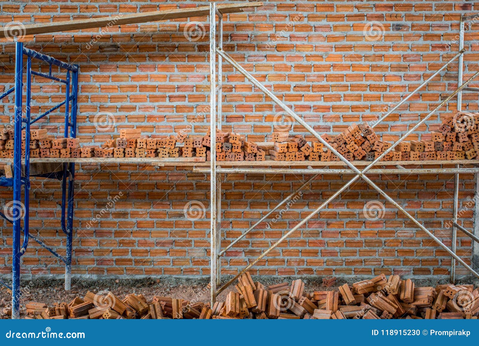 New Interior Red Brick Wall with Scaffolding Under Construction Stock