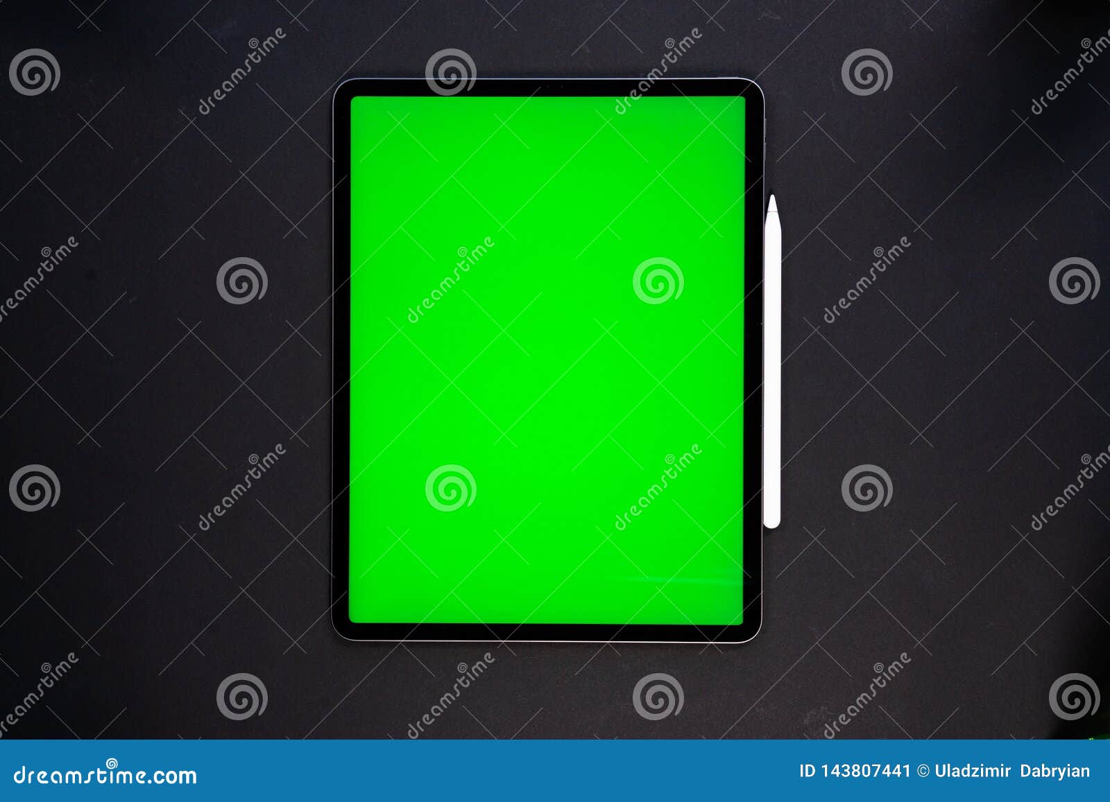 IPad and IPhone, New Tablet on a Black Background with a Pen, and Green