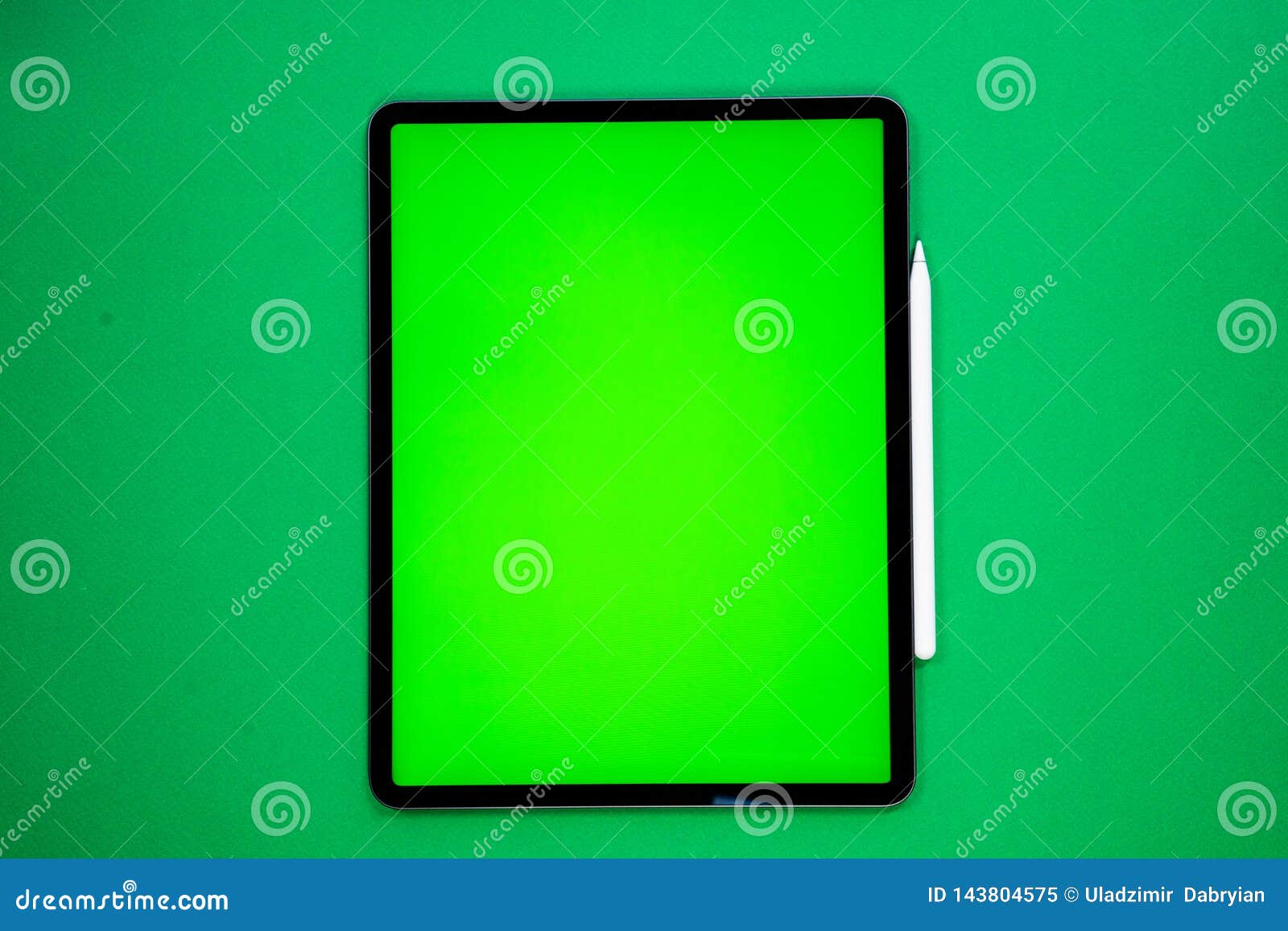 IPad and IPhone, New Tablet on a Green Background with a Pen, and Green