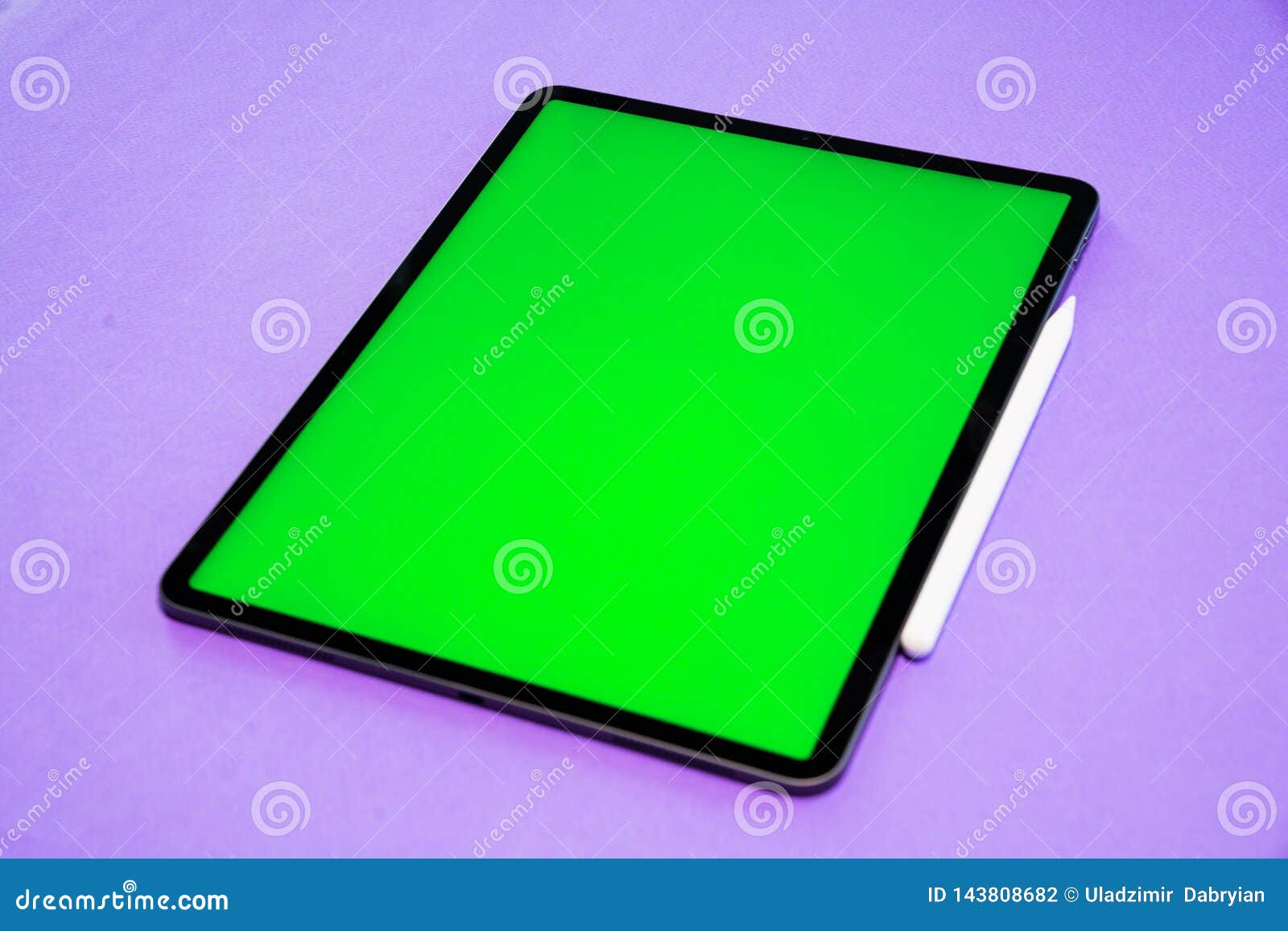 IPad and IPhone, New Tablet on a Violet Background with a Pen, and