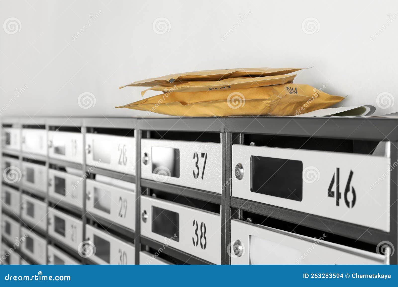 New Mailboxes with Keyholes, Numbers, Receipts and Envelopes in Post Office Stock Photo Image
