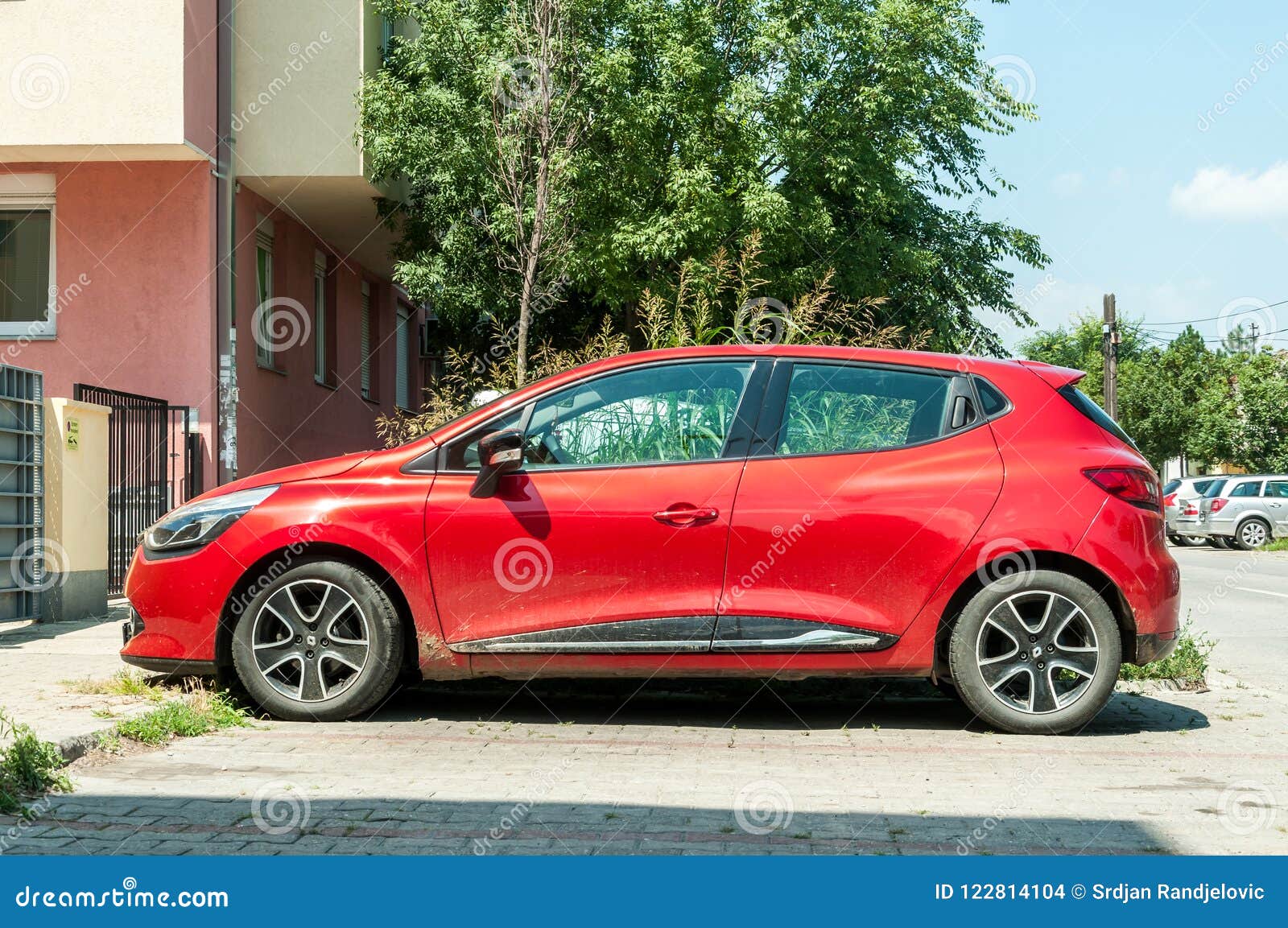 New Red Renault Clio IV Car with Alloy Wheels Parked on the Street in the City. Editorial Image - Image of classic, town: 122814104