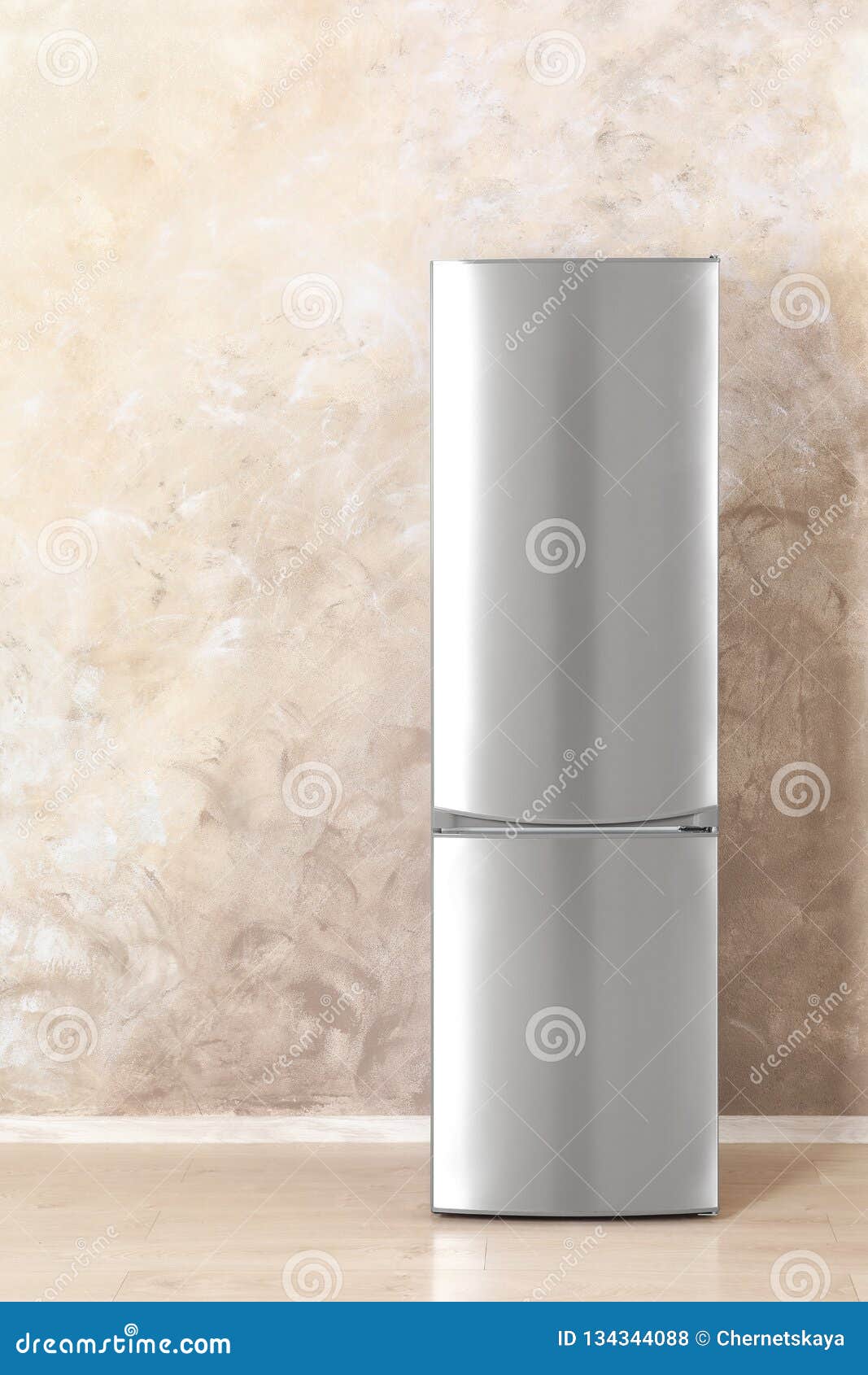 New Refrigerator Near Grey Wall Indoors. Stock Photo Image of