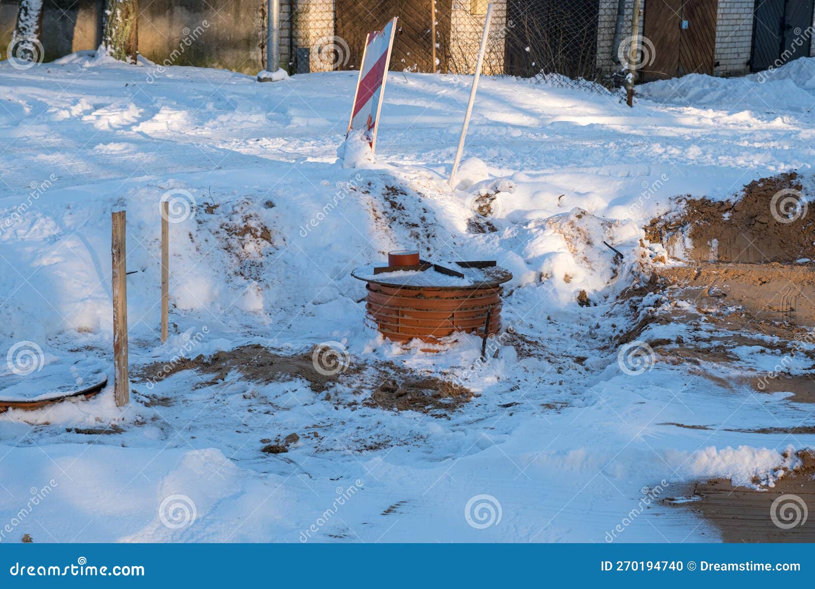 New Road Construction Site in the Forest in Winter with Snow and Mud
