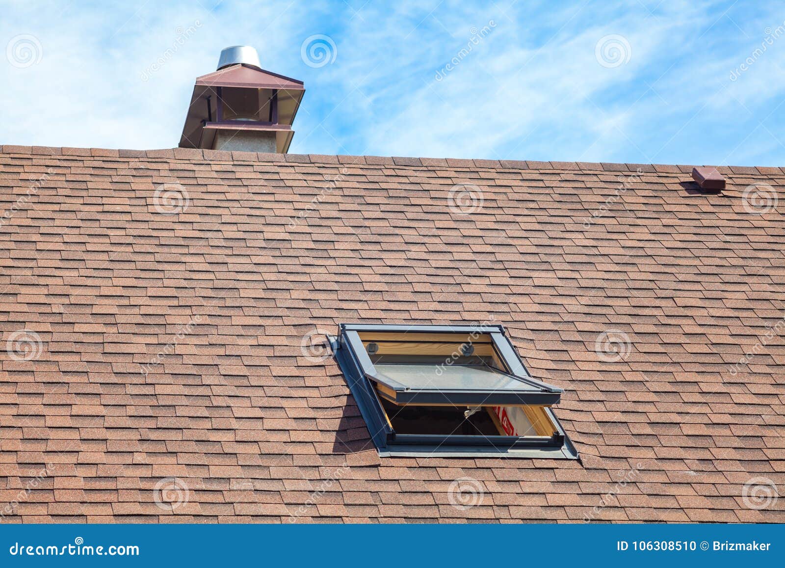 new roof with skylight, asphalt roofing shingles and chimney. roof with mansard windows