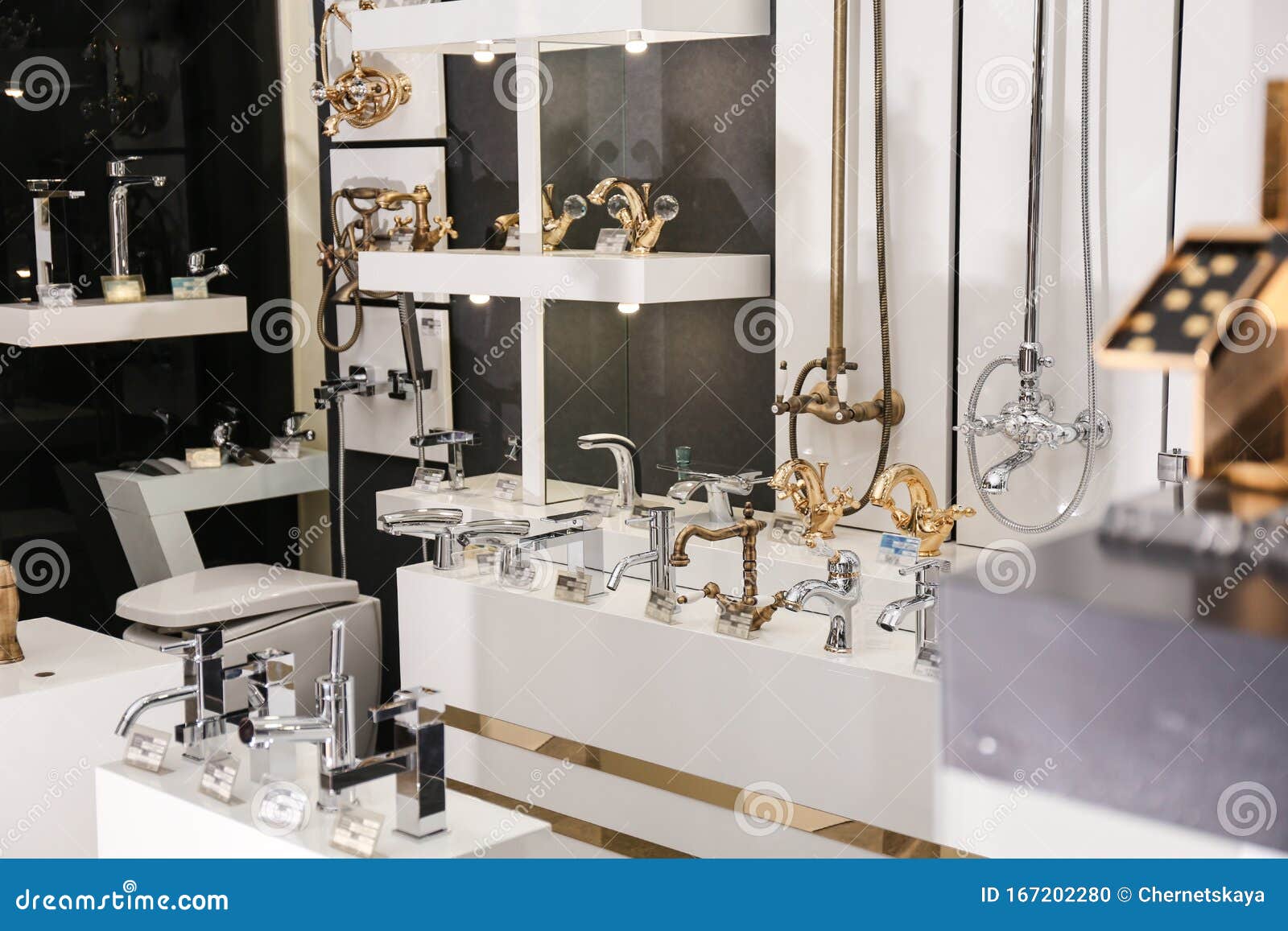 New Shiny Faucets In Bathroom Fixtures Store Stock Photo Image